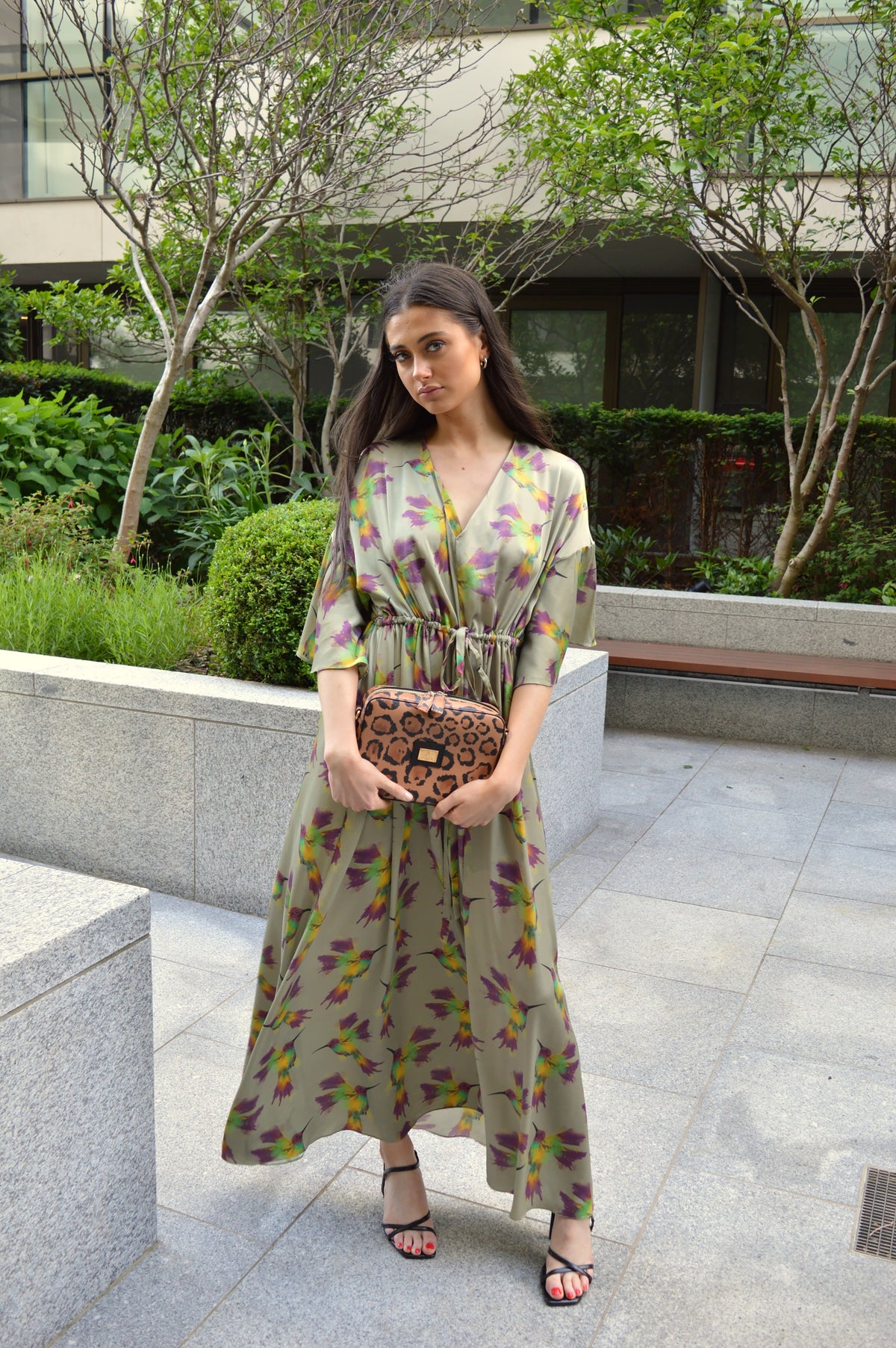 Flavia, crossbody bag in leopard-print Italian Ruga leather – carried by hand, styled with the Caterina Silk Dress