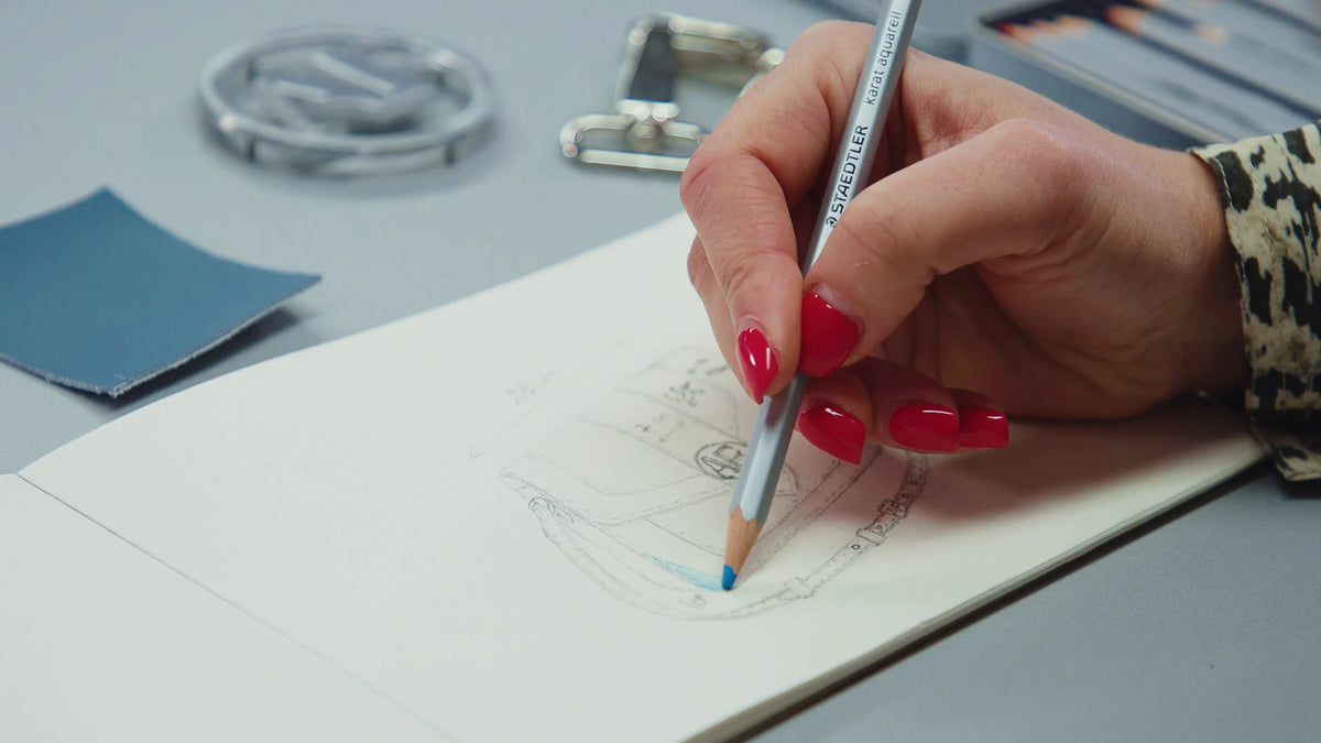 Alinari craftsperson cutting, stitching and finishing an Italian leather bag by hand