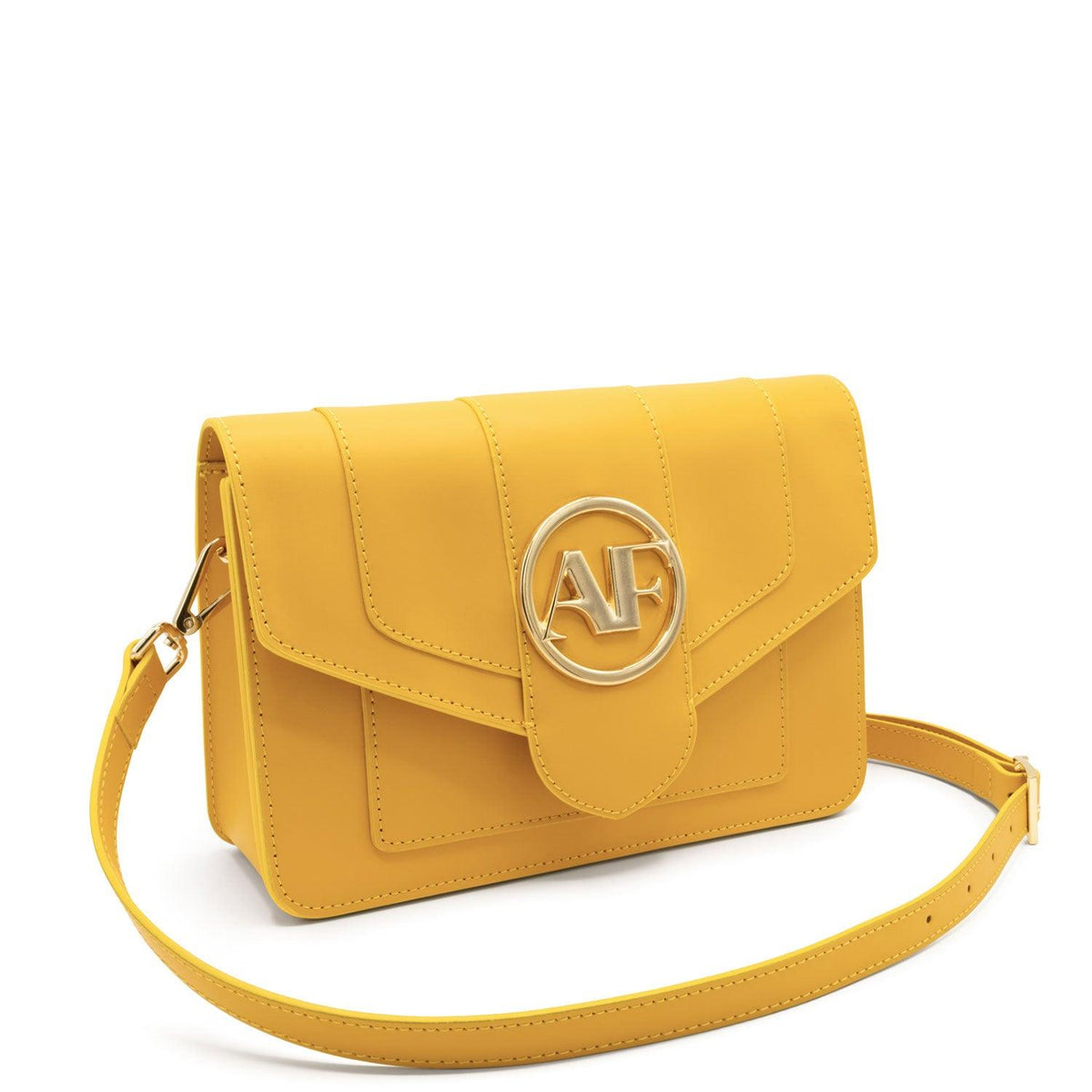 Brera, crossbody bag in yellow smooth Italian Ruga leather – three-quarter view with strap