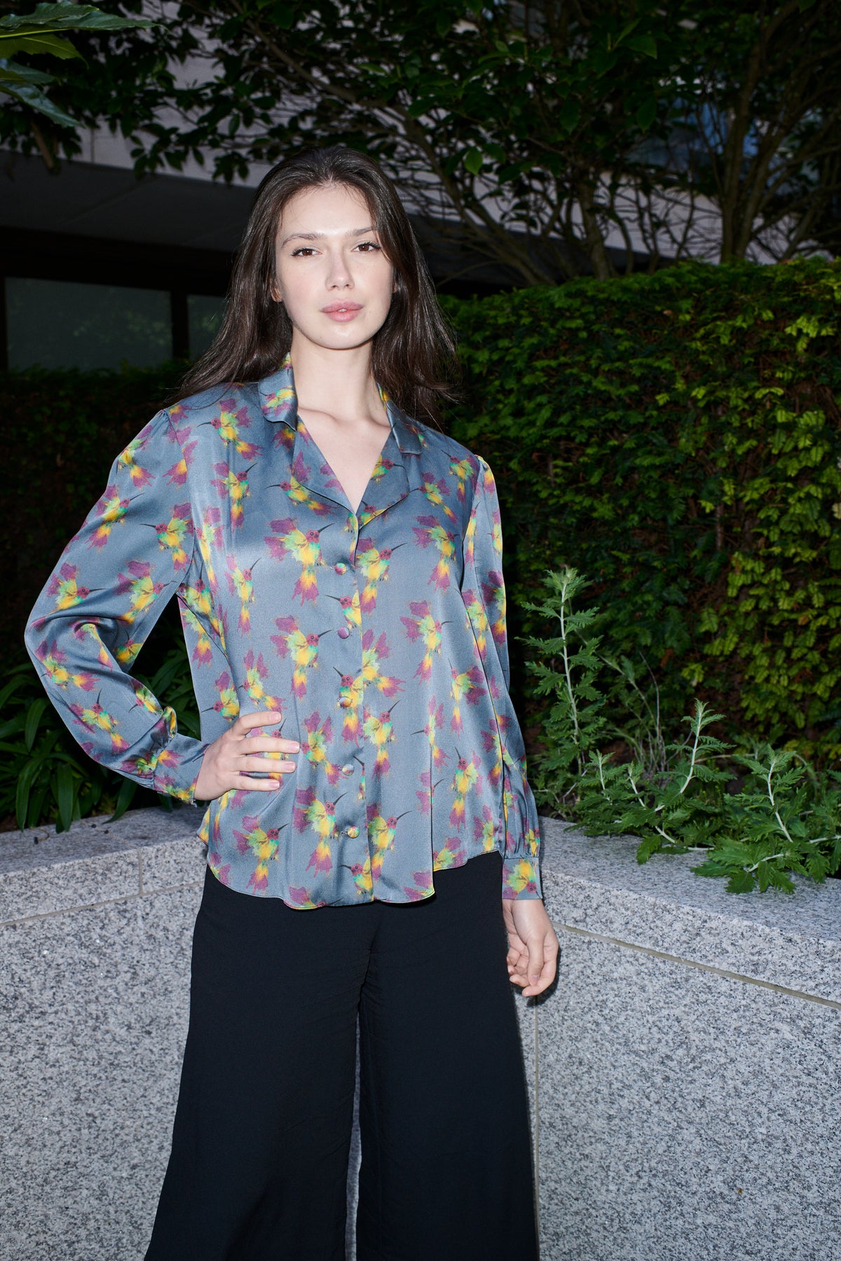 Celestina, blouse in steel blue hummingbird-print 100% Mulberry silk – on model – Alinari Firenze