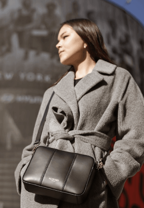 Flavia, crossbody bag in black Italian Ruga leather – styled photo