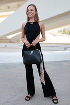 Navona Classic, top-handle bag in smooth black Italian leather – carried by hand
