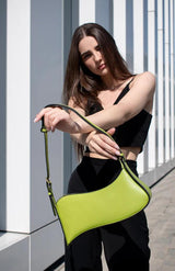 A fashionable fashionista showing off her Alinarifirenze Ala Shoulder Bag.