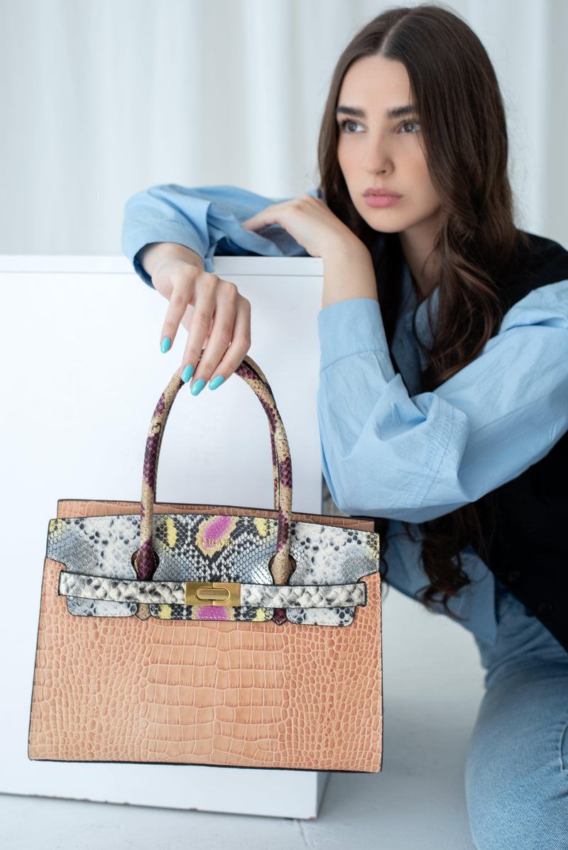 The Alina Tote Bag, made of python skin, offers both style and functionality, making it an essential accessory for every wardrobe. (Brand Name: Alinarifirenze)