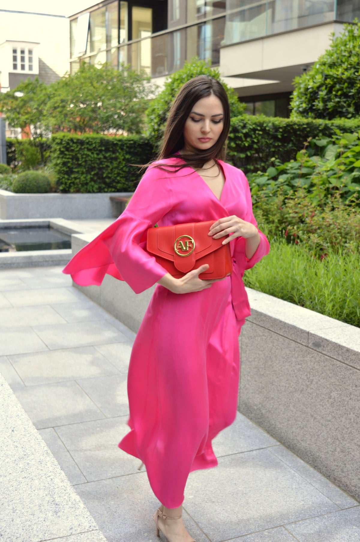 Brera, crossbody bag in red smooth Italian Ruga leather – carried by hand, styled with the Luna Silk Dress