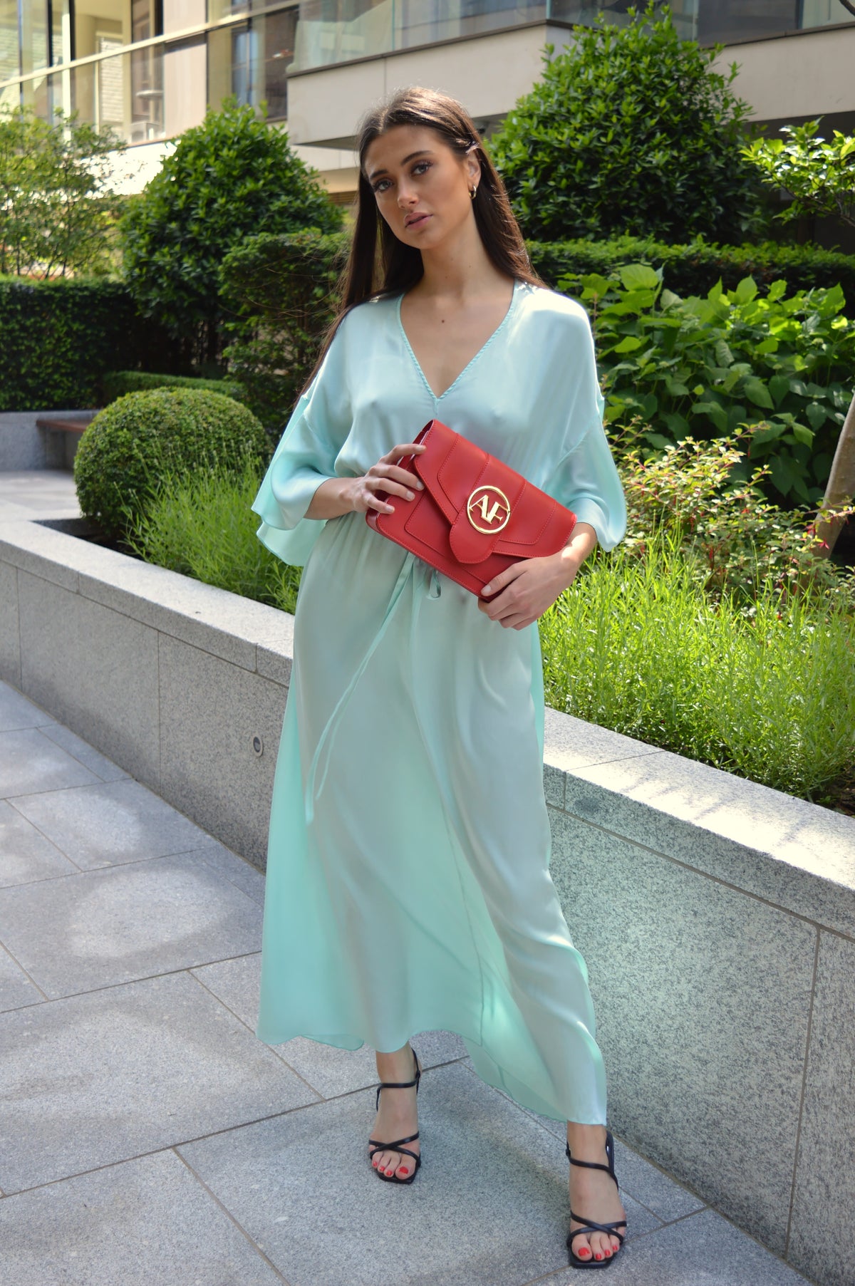 Brera, crossbody bag in red smooth Italian Ruga leather – carried by hand, styled with the Isabella Silk Dress