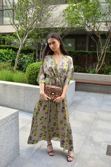 Flavia, crossbody bag in leopard-print Italian Ruga leather – carried by hand, styled with the Caterina Silk Dress