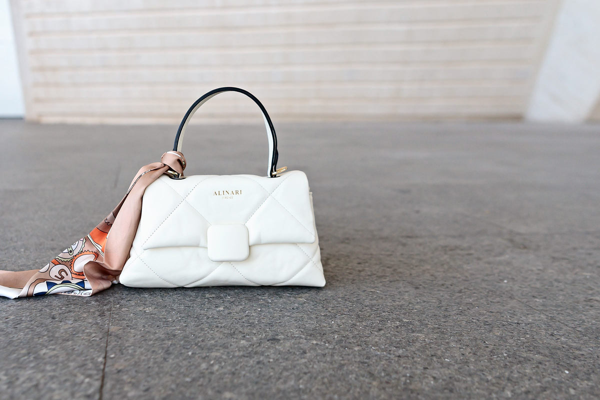 Alita white quilted Italian leather bag on pale stone with a printed silk twilly