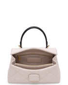 Alita quilted leather shoulder bag in white, open to show the inside
