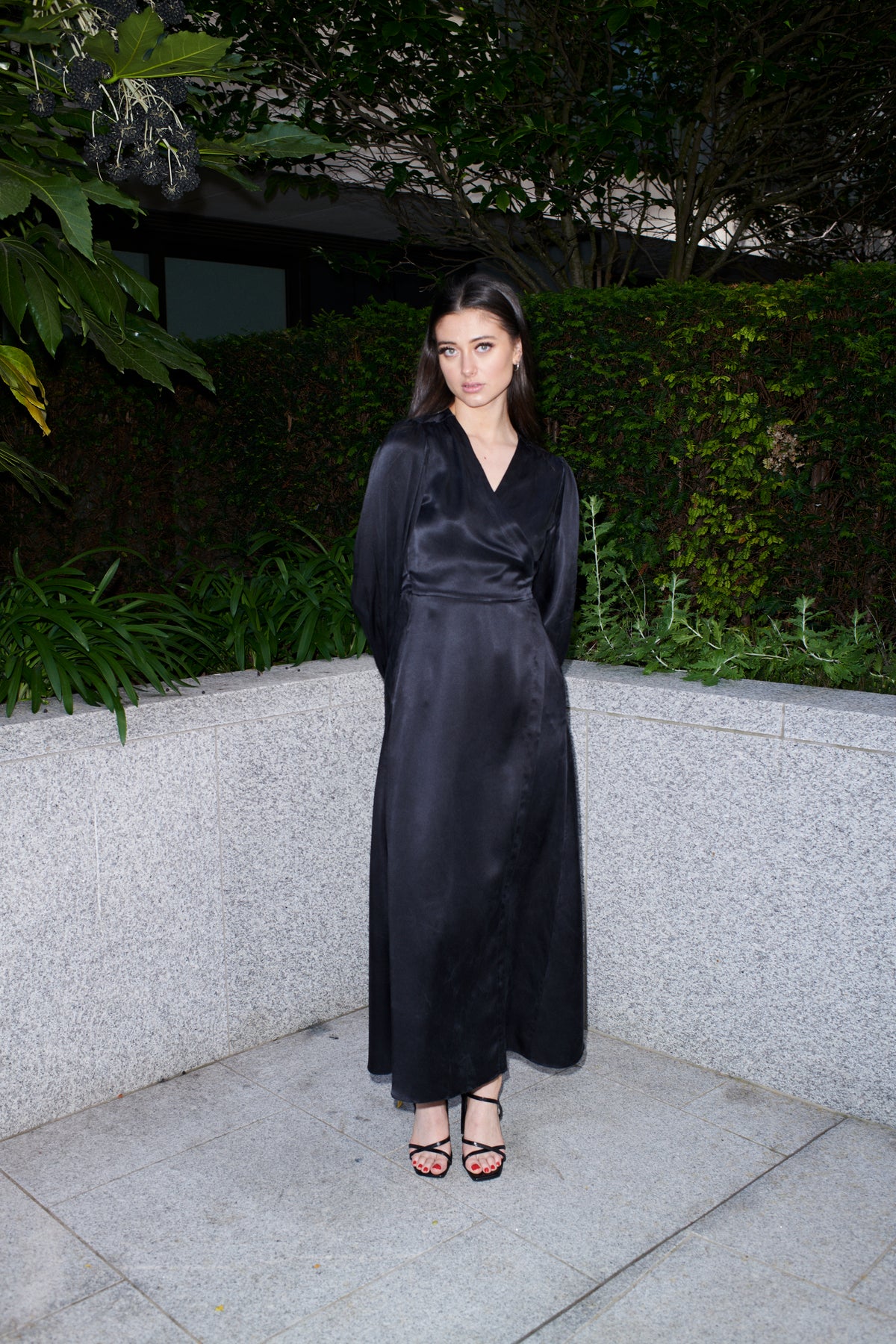 Beatrice, wrap dress in black 100% Mulberry silk – on model 2 – Alinari Firenze