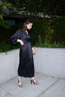 Beatrice, wrap dress in black 100% Mulberry silk – on model – Alinari Firenze