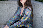 Celestina, blouse in steel blue hummingbird-print 100% Mulberry silk – on model 3 – Alinari Firenze