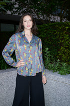 Celestina, blouse in steel blue hummingbird-print 100% Mulberry silk – on model – Alinari Firenze