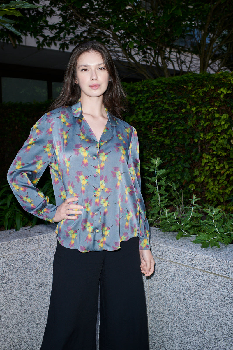 Celestina, blouse in steel blue hummingbird-print 100% Mulberry silk – on model – Alinari Firenze