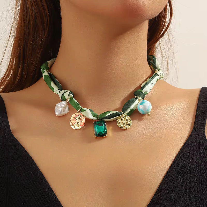 Charm Silk Scarf Necklace, necklace in multicolour printed scarf and alloy charms – styled view – Alinari Firenze