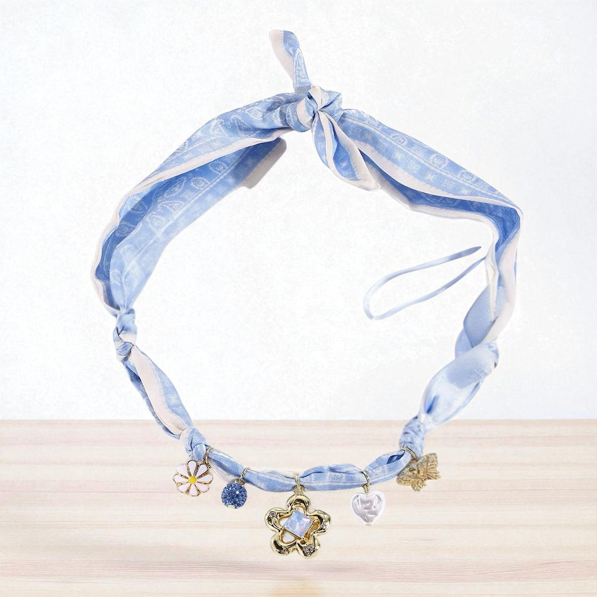 Charm Silk Scarf Necklace, necklace in blue printed scarf and alloy charms – product view – Alinari Firenze