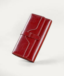 Classic Oil-Wax Wallet, wallet in red oil-wax cow leather – styled view – Alinari Firenze