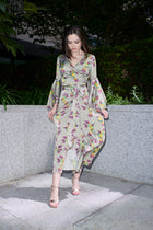 Fiona, wrap dress in sage hummingbird-print 100% Mulberry silk – on model 2 – Alinari Firenze
