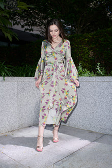 Fiona, wrap dress in sage hummingbird-print 100% Mulberry silk – on model 2 – Alinari Firenze
