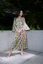 Fiona, wrap dress in sage hummingbird-print 100% Mulberry silk – on model – Alinari Firenze