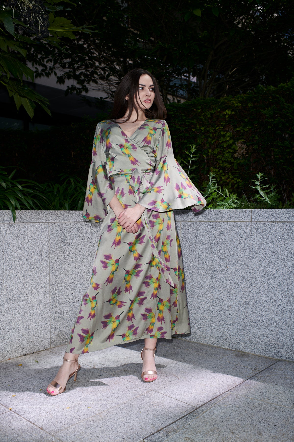 Fiona, wrap dress in sage hummingbird-print 100% Mulberry silk – on model – Alinari Firenze