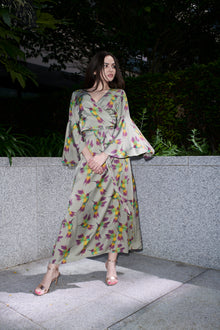 Fiona, wrap dress in sage hummingbird-print 100% Mulberry silk – on model – Alinari Firenze