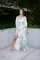 Giulia, silk wrap dress in lemon-print 100% Mulberry silk – on model – Alinari Firenze