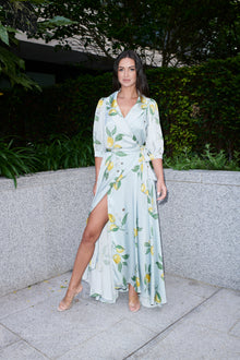 Giulia, silk wrap dress in lemon-print 100% Mulberry silk – on model – Alinari Firenze