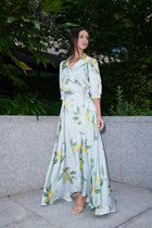 Giulia, silk wrap dress in lemon-print 100% Mulberry silk – on model 2 – Alinari Firenze