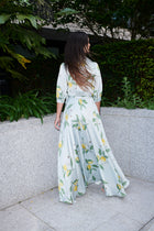 Giulia, silk wrap dress in lemon-print 100% Mulberry silk – on model 3 – Alinari Firenze