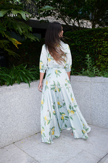 Giulia, silk wrap dress in lemon-print 100% Mulberry silk – on model 3 – Alinari Firenze