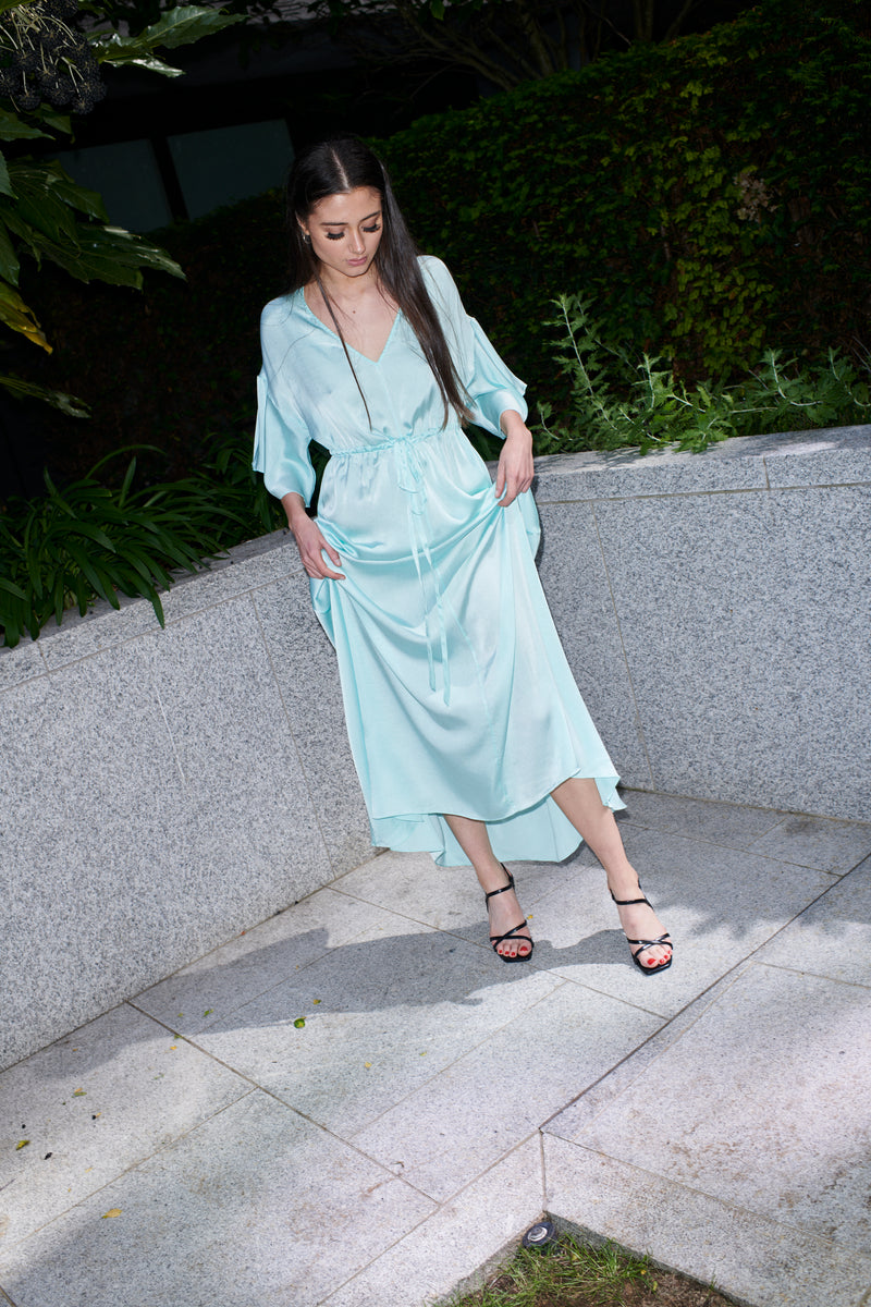 Isabella, kimono-sleeve dress in aquamarine 100% Mulberry silk – on model 2 – Alinari Firenze