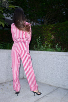 Justina, wrap top and trouser set in raspberry and white striped 100% Mulberry silk – on model – Alinari Firenze