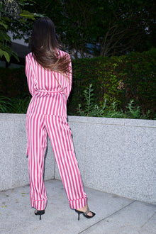 Justina, wrap top and trouser set in raspberry and white striped 100% Mulberry silk – on model – Alinari Firenze