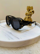 Lunaria, sunglasses in black, UV400 protection – styled view 2 – Alinari Firenze