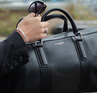 Milano, travel bag in black deer-print Italian calfskin – carried by hand