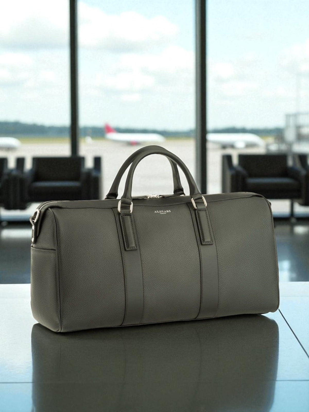 Milano, travel bag in black deer-print Italian calfskin – styled photo
