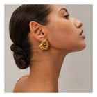 Sculpted Knot, statement earrings in gold high-shine – front view – Alinari Firenze
