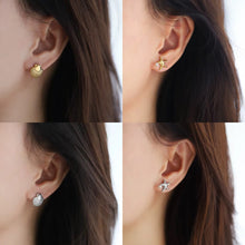 Sea Star and Shell, stud earrings in gold and silver pearl-accent – styled view 4 – Alinari Firenze